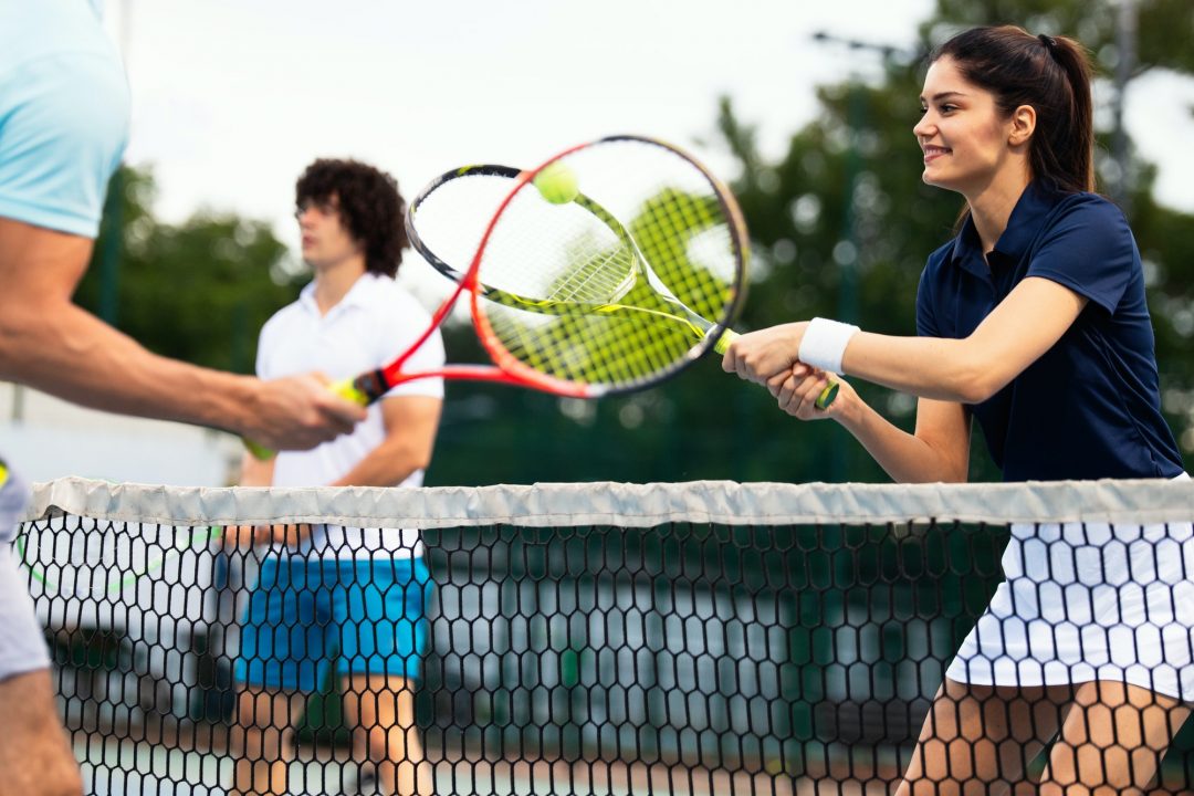 fit happy poeple playing tennis together sport concept